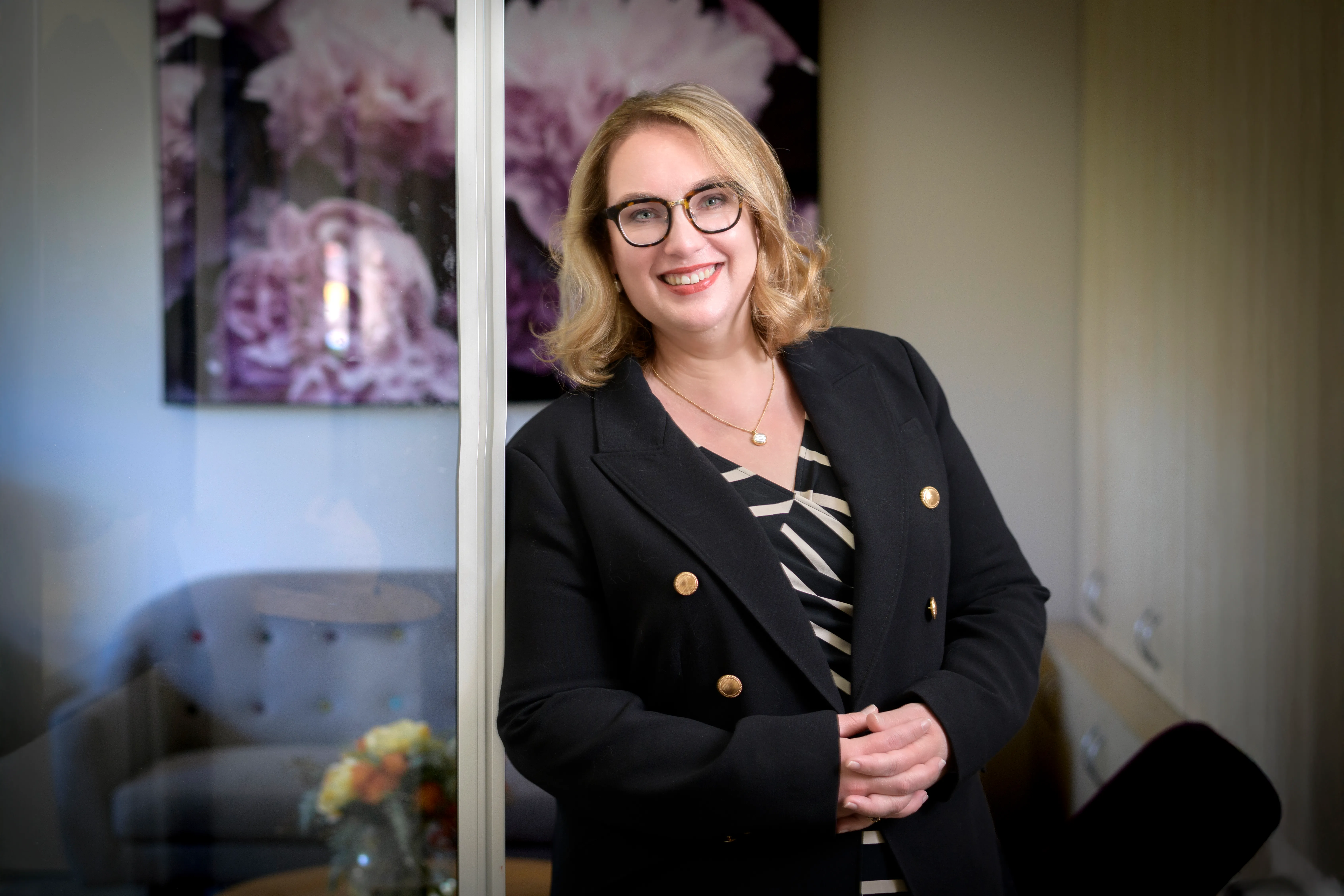 Environmental headshot of a businesswoman in an office