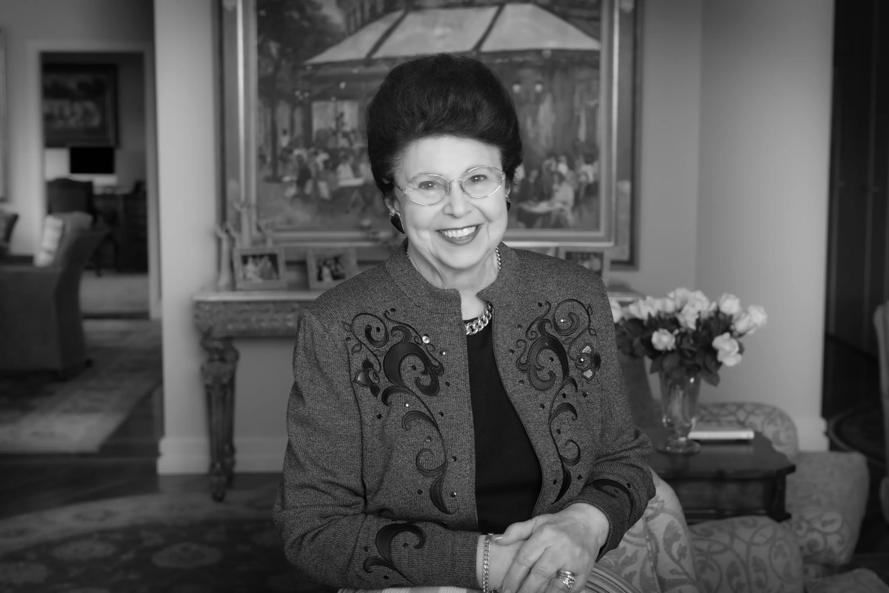 A company founder photographed in her office, black and white