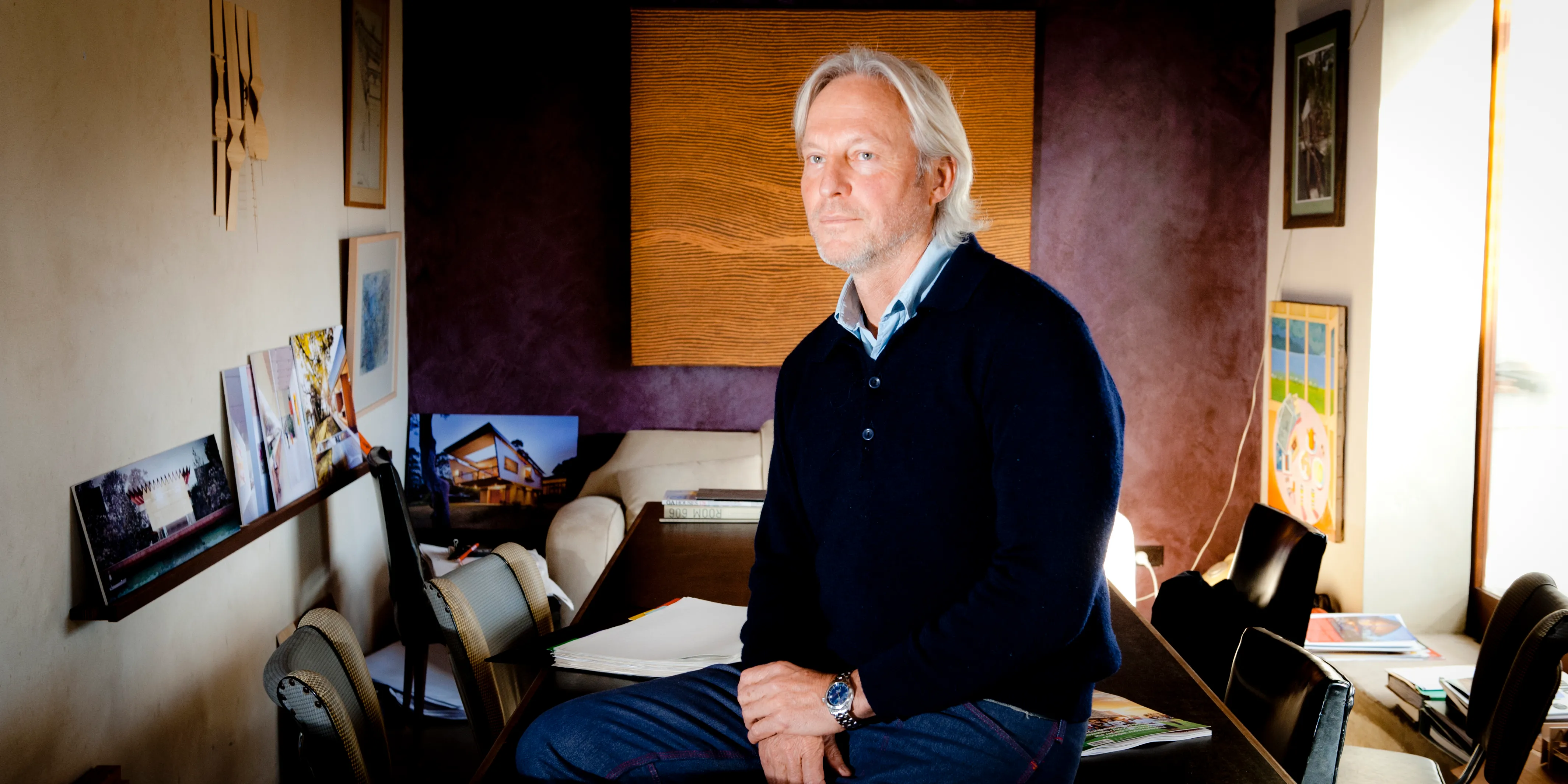 An architect photographed at his drawing desk